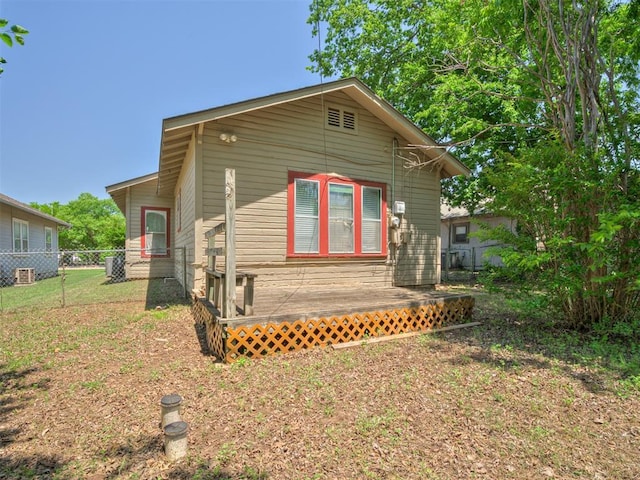 view of property exterior featuring a deck