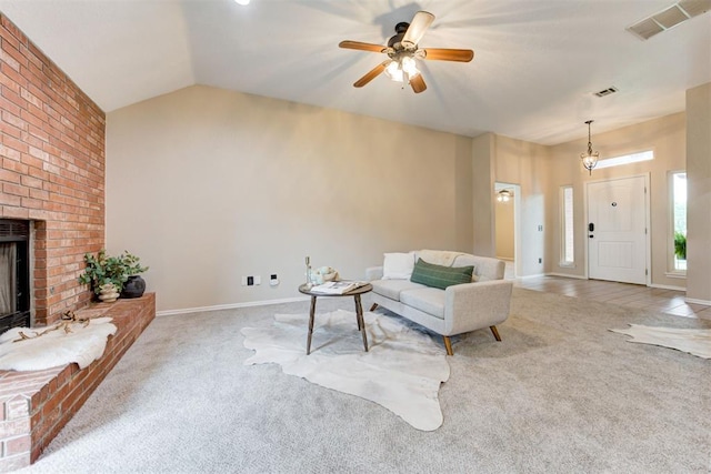 619 Rimrock Rd, Edmond, OK 73034 - carpeted living area featuring ceiling fan, a brick fireplace, vaulted ceiling, and baseboards