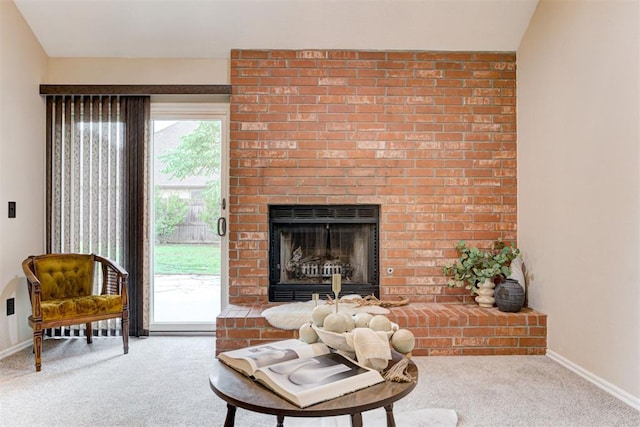 619 Rimrock Rd, Edmond, OK 73034 - living area featuring carpet flooring, baseboards, and a brick fireplace