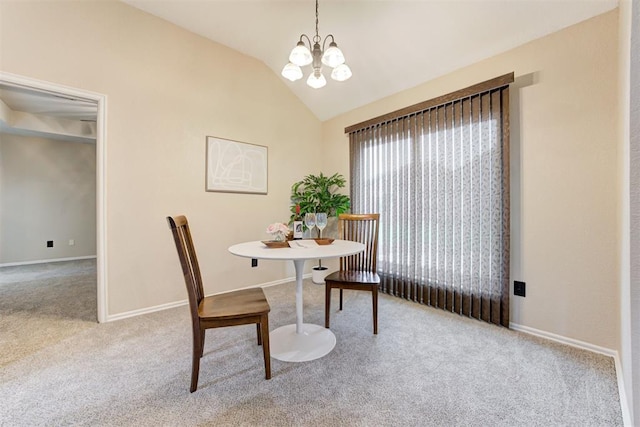 619 Rimrock Rd, Edmond, OK 73034 - dining area with carpet flooring, a chandelier, lofted ceiling, and baseboards