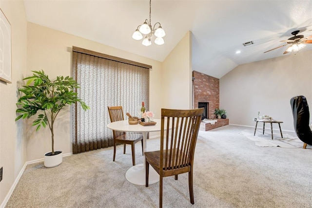 619 Rimrock Rd, Edmond, OK 73034 - dining space featuring lofted ceiling, carpet flooring, a ceiling fan, baseboards, and a brick fireplace