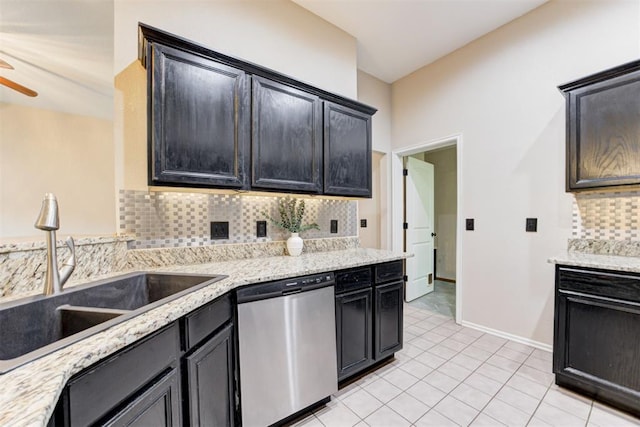 619 Rimrock Rd, Edmond, OK 73034 - kitchen with dishwasher, a sink, backsplash, ceiling fan, and light tile patterned floors