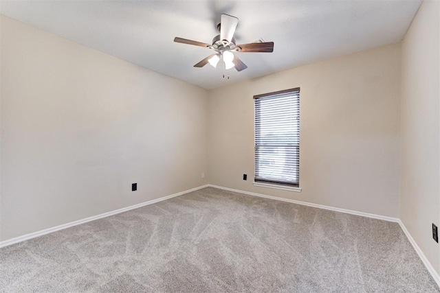 619 Rimrock Rd, Edmond, OK 73034 - spare room featuring carpet, a ceiling fan, and baseboards