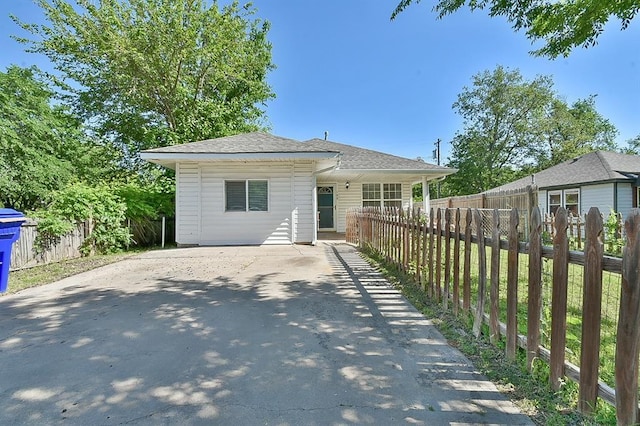109 E Hayes St, Norman, OK 73069 - view of front of property featuring fence, a shingled roof, and driveway