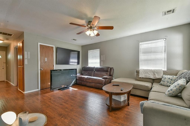 109 E Hayes St, Norman, OK 73069 - living room with wood finished floors, a ceiling fan, a textured ceiling, and baseboards