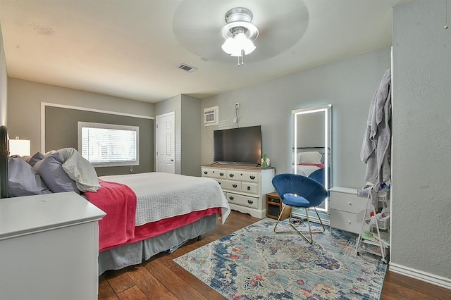 109 E Hayes St, Norman, OK 73069 - bedroom featuring dark wood-style floors, baseboards, a ceiling fan, and a closet