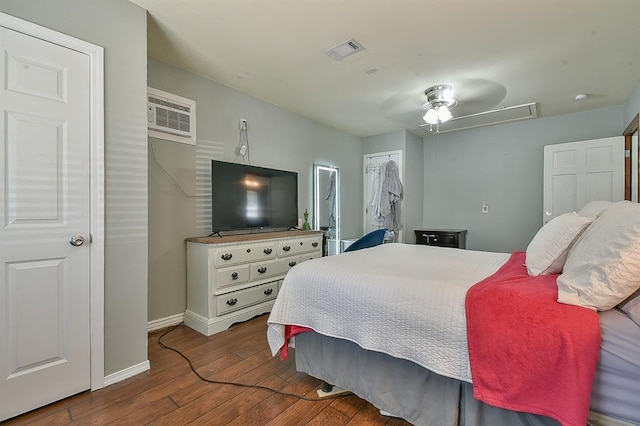 109 E Hayes St, Norman, OK 73069 - bedroom featuring hardwood / wood-style floors, baseboards, and a wall unit AC