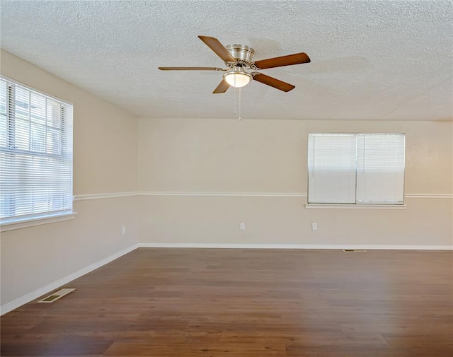 5016 NW 26th St, Oklahoma City, OK 73127 - spare room featuring wood finished floors, a textured ceiling, ceiling fan, and baseboards