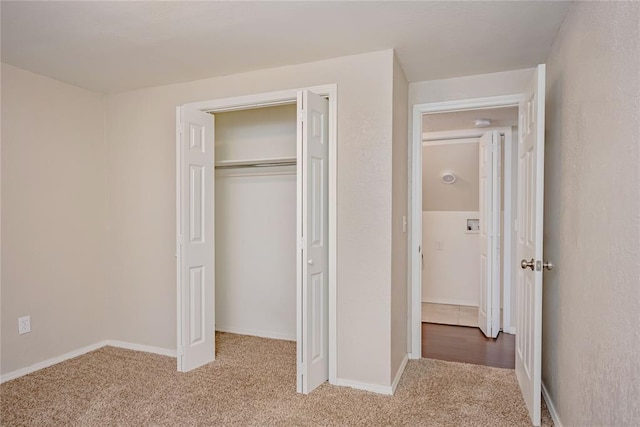 5016 NW 26th St, Oklahoma City, OK 73127 - unfurnished bedroom featuring carpet, a closet, and baseboards