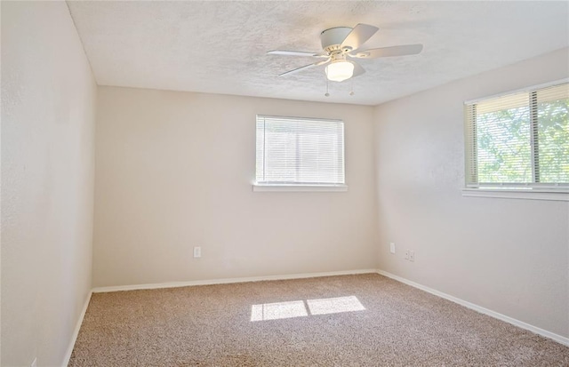 5016 NW 26th St, Oklahoma City, OK 73127 - carpeted empty room featuring baseboards, a ceiling fan, and a textured ceiling
