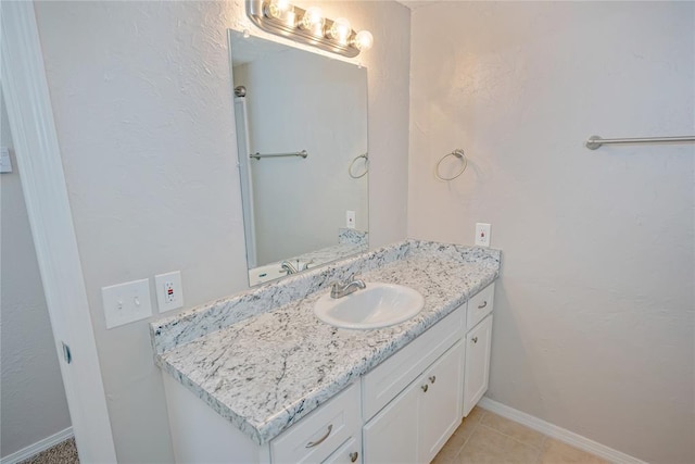 5016 NW 26th St, Oklahoma City, OK 73127 - bathroom with vanity, tile patterned floors, and baseboards
