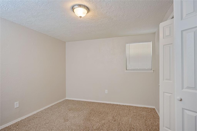 5016 NW 26th St, Oklahoma City, OK 73127 - carpeted spare room with a textured ceiling and baseboards