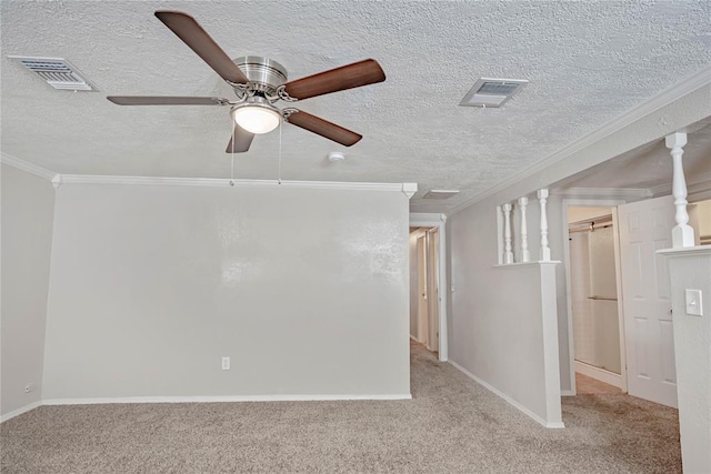 5016 NW 26th St, Oklahoma City, OK 73127 - carpeted spare room featuring crown molding, ceiling fan, baseboards, and a textured ceiling