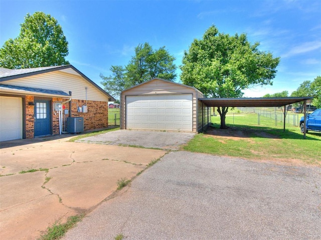 764 S Sara Rd, Tuttle, OK 73089 - garage featuring a detached garage and central AC