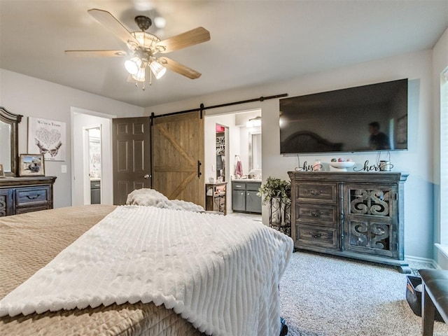764 S Sara Rd, Tuttle, OK 73089 - carpeted bedroom featuring a barn door, ensuite bath, and a ceiling fan