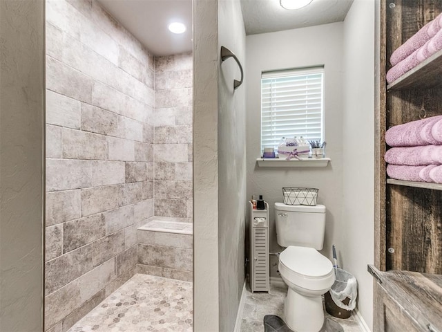 764 S Sara Rd, Tuttle, OK 73089 - full bathroom with tiled shower, baseboards, and toilet