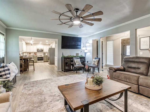 764 S Sara Rd, Tuttle, OK 73089 - living room with crown molding, ceiling fan, light wood-type flooring, and baseboards
