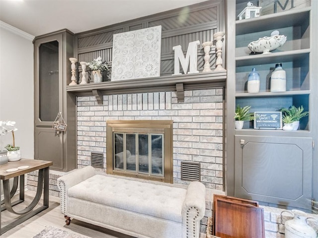764 S Sara Rd, Tuttle, OK 73089 - living room with ornamental molding, a brick fireplace, and wood finished floors