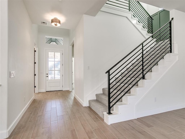 4405 Las Colinas Ln, Norman, OK 73072 - entryway featuring light wood finished floors, baseboards, and stairs