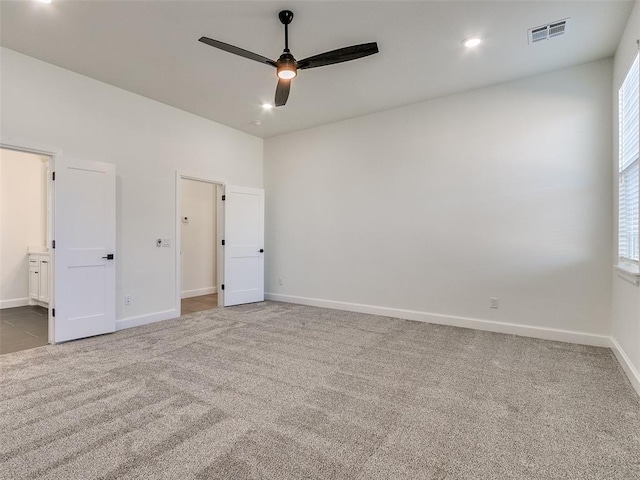 4405 Las Colinas Ln, Norman, OK 73072 - unfurnished bedroom with carpet floors, baseboards, and multiple windows