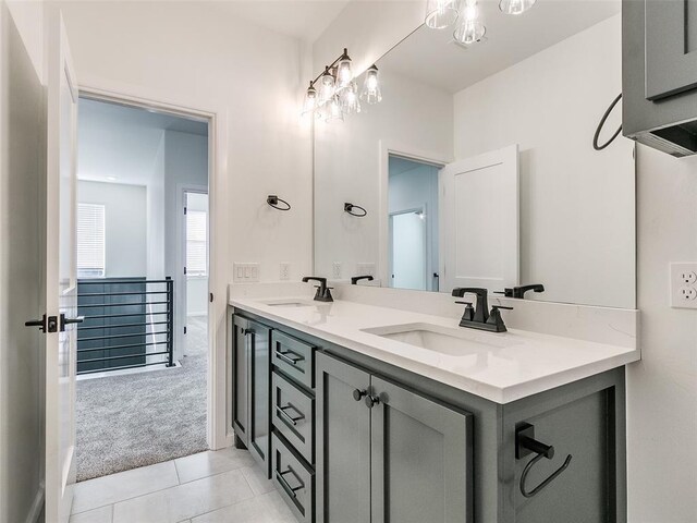 4405 Las Colinas Ln, Norman, OK 73072 - full bath with double vanity, tile patterned floors, and a chandelier