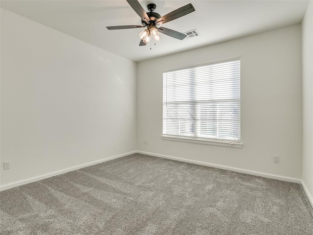 4405 Las Colinas Ln, Norman, OK 73072 - empty room featuring carpet, ceiling fan, and baseboards