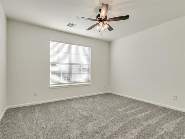 4405 Las Colinas Ln, Norman, OK 73072 - empty room featuring carpet floors, a ceiling fan, and baseboards