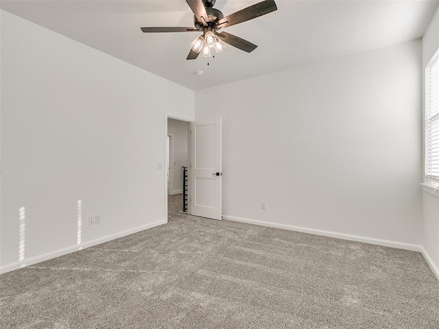 4405 Las Colinas Ln, Norman, OK 73072 - carpeted empty room featuring baseboards and a ceiling fan