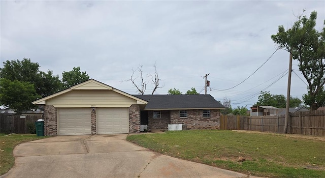 6805 Saint Marys Cir, Oklahoma City, OK 73132 - ranch-style house with brick siding, driveway, and an attached garage