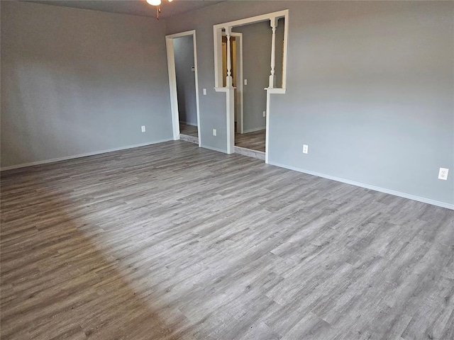 6805 Saint Marys Cir, Oklahoma City, OK 73132 - spare room with wood finished floors, baseboards, and ceiling fan