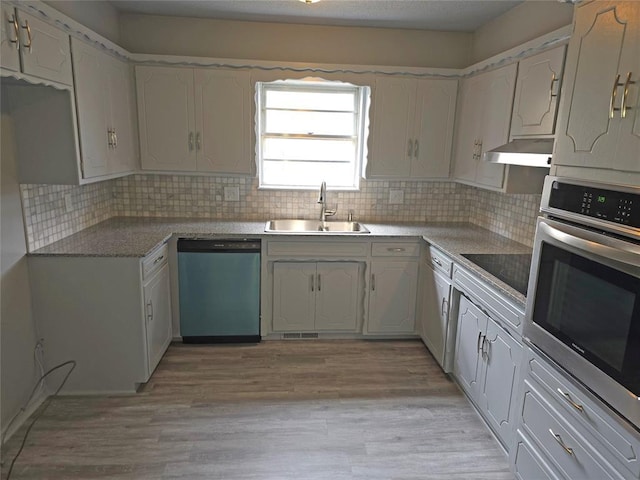 6805 Saint Marys Cir, Oklahoma City, OK 73132 - kitchen featuring dishwasher, a sink, oven, black electric stovetop, and tasteful backsplash