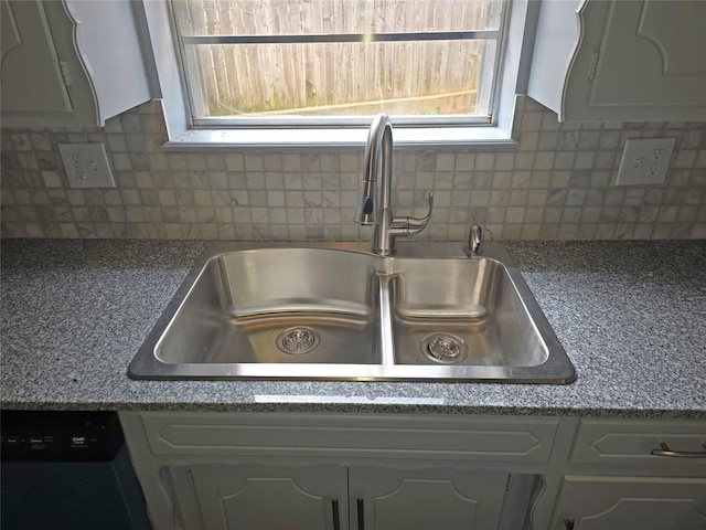 6805 Saint Marys Cir, Oklahoma City, OK 73132 - kitchen view of a sink, white cabinets, backsplash, and dishwashing machine