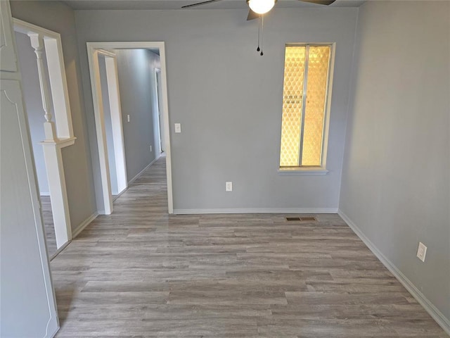 6805 Saint Marys Cir, Oklahoma City, OK 73132 - spare room featuring ceiling fan, wood finished floors, and baseboards