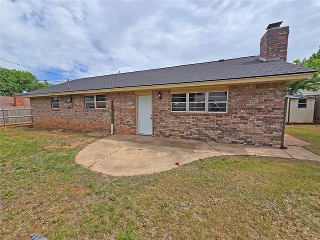 6805 Saint Marys Cir, Oklahoma City, OK 73132 - back of property featuring a patio, brick siding, a chimney, a storage shed, and an outbuilding