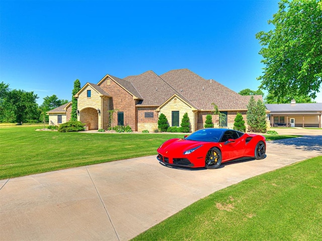 15001 N Frisco Rd, Piedmont, OK 73078 - view of front of property featuring a front lawn, brick siding, and stone siding