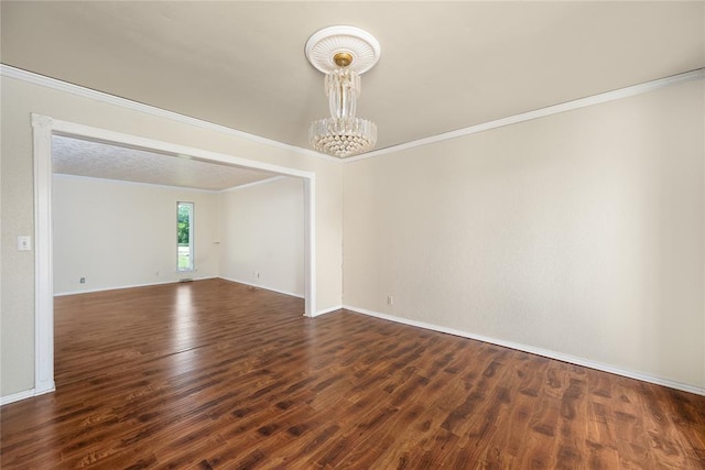 410 NW Taylor Ave, Piedmont, OK 73078 - unfurnished room with a chandelier, ornamental molding, dark wood-style floors, and baseboards