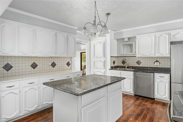410 NW Taylor Ave, Piedmont, OK 73078 - kitchen featuring stainless steel appliances, a chandelier, tasteful backsplash, dark wood-style floors, and a sink