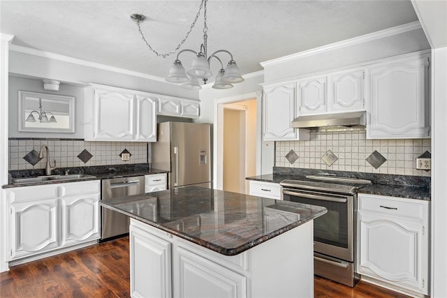 410 NW Taylor Ave, Piedmont, OK 73078 - kitchen featuring stainless steel appliances, a sink, exhaust hood, a chandelier, and white cabinetry