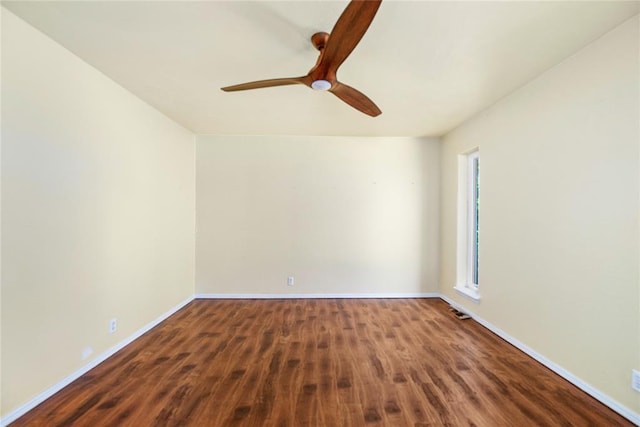 410 NW Taylor Ave, Piedmont, OK 73078 - empty room featuring wood finished floors, a ceiling fan, and baseboards