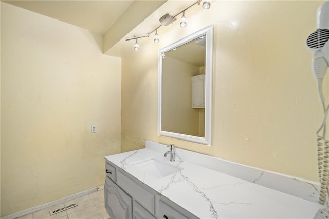 410 NW Taylor Ave, Piedmont, OK 73078 - bathroom featuring vanity, tile patterned floors, and baseboards