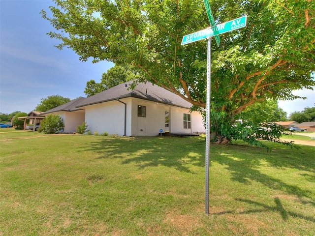 6001 Broadmoor Ave, Oklahoma City, OK 73132 - rear view of property with a lawn