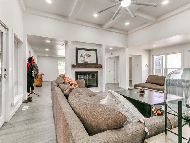 6001 Broadmoor Ave, Oklahoma City, OK 73132 - living room featuring ceiling fan, coffered ceiling, baseboards, beam ceiling, and a large fireplace