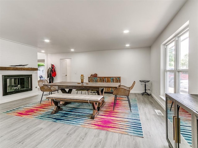 6001 Broadmoor Ave, Oklahoma City, OK 73132 - playroom with wood finished floors, healthy amount of natural light, recessed lighting, a glass covered fireplace, and baseboards