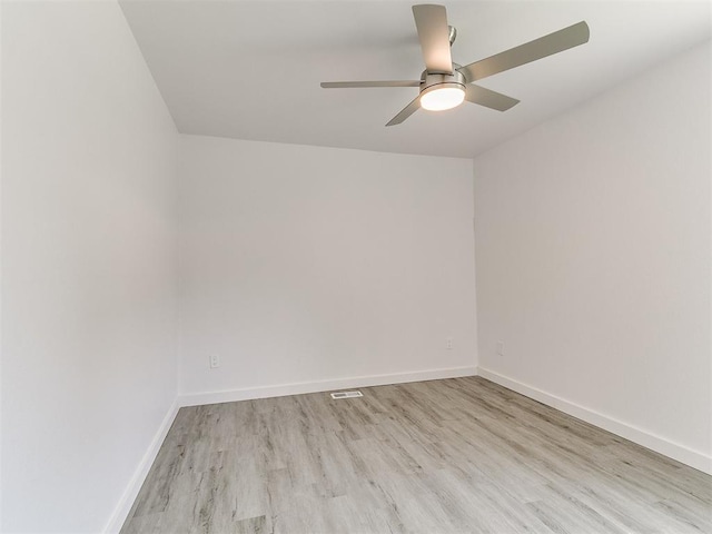 6001 Broadmoor Ave, Oklahoma City, OK 73132 - unfurnished room featuring wood finished floors, ceiling fan, and baseboards
