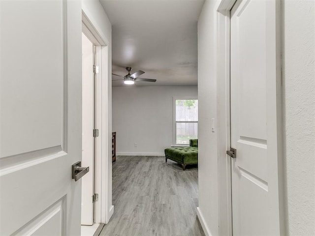 6001 Broadmoor Ave, Oklahoma City, OK 73132 - hallway with light wood-style flooring and baseboards