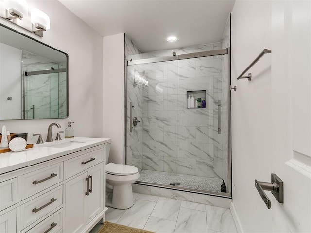 6001 Broadmoor Ave, Oklahoma City, OK 73132 - full bath featuring marble look tile flooring, a marble finish shower, toilet, vanity, and recessed lighting
