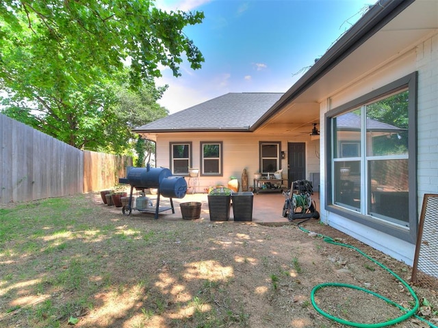 6001 Broadmoor Ave, Oklahoma City, OK 73132 - fenced backyard featuring a patio area and ceiling fan