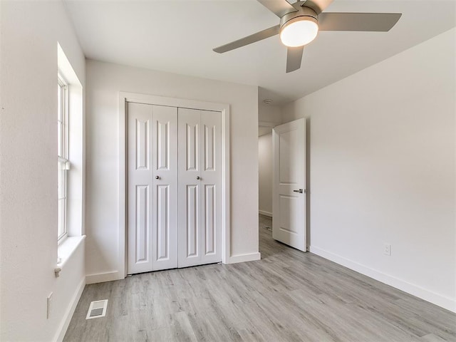 6001 Broadmoor Ave, Oklahoma City, OK 73132 - unfurnished bedroom featuring light wood finished floors, a closet, and ceiling fan