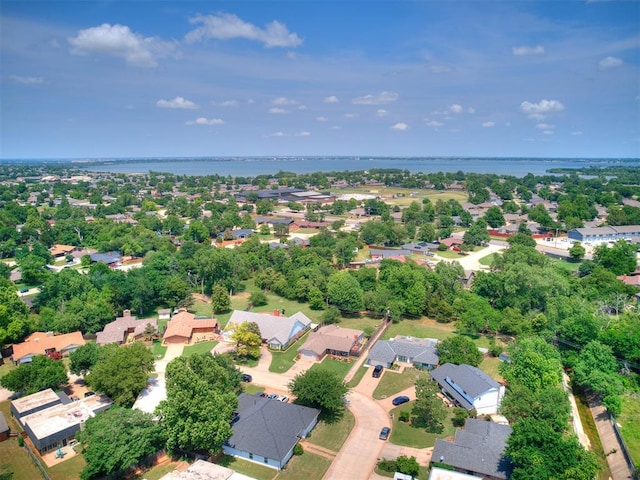 6001 Broadmoor Ave, Oklahoma City, OK 73132 - aerial view of property and surrounding area with a large body of water and nearby suburban area