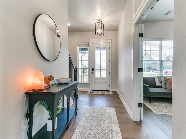 222 Alamosa Rd, Norman, OK 73069 - foyer entrance featuring dark wood-style flooring, stairs, baseboards, and a chandelier